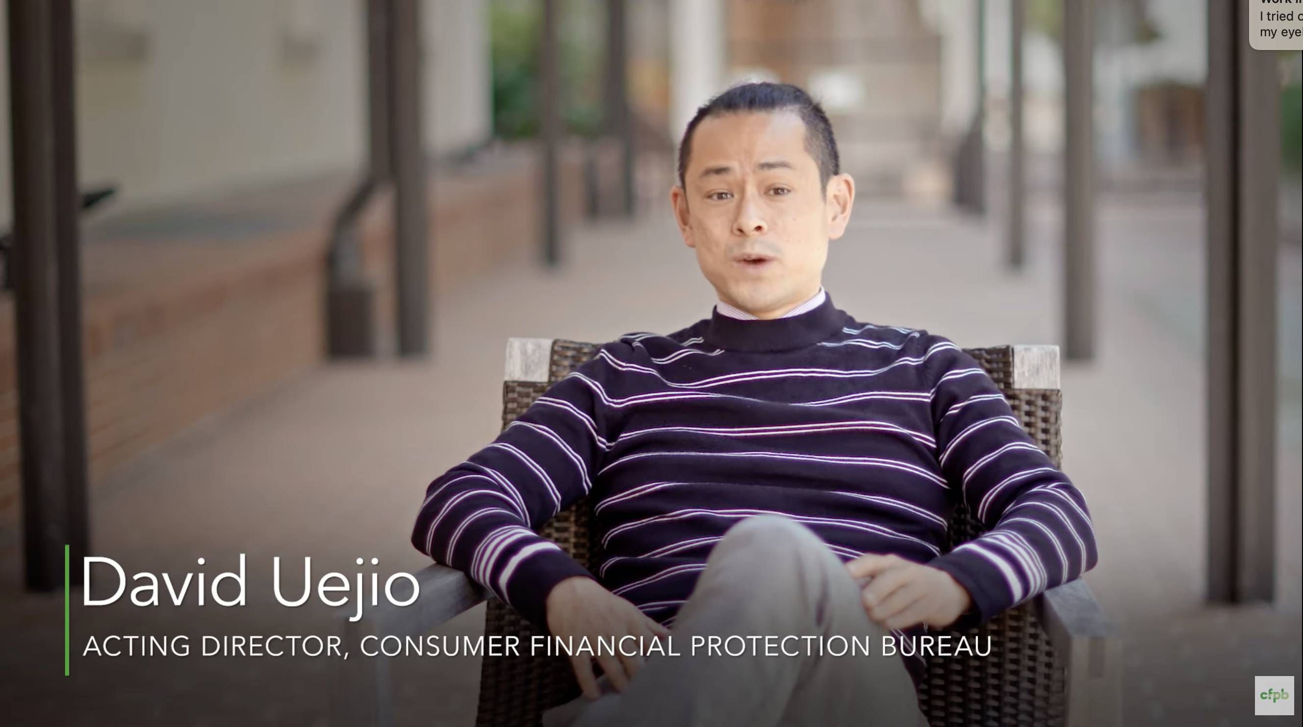 Footage of David Uejio with the text "David Uejio Acting Director, Consumer Financial Protection Bureau" on top of the footage